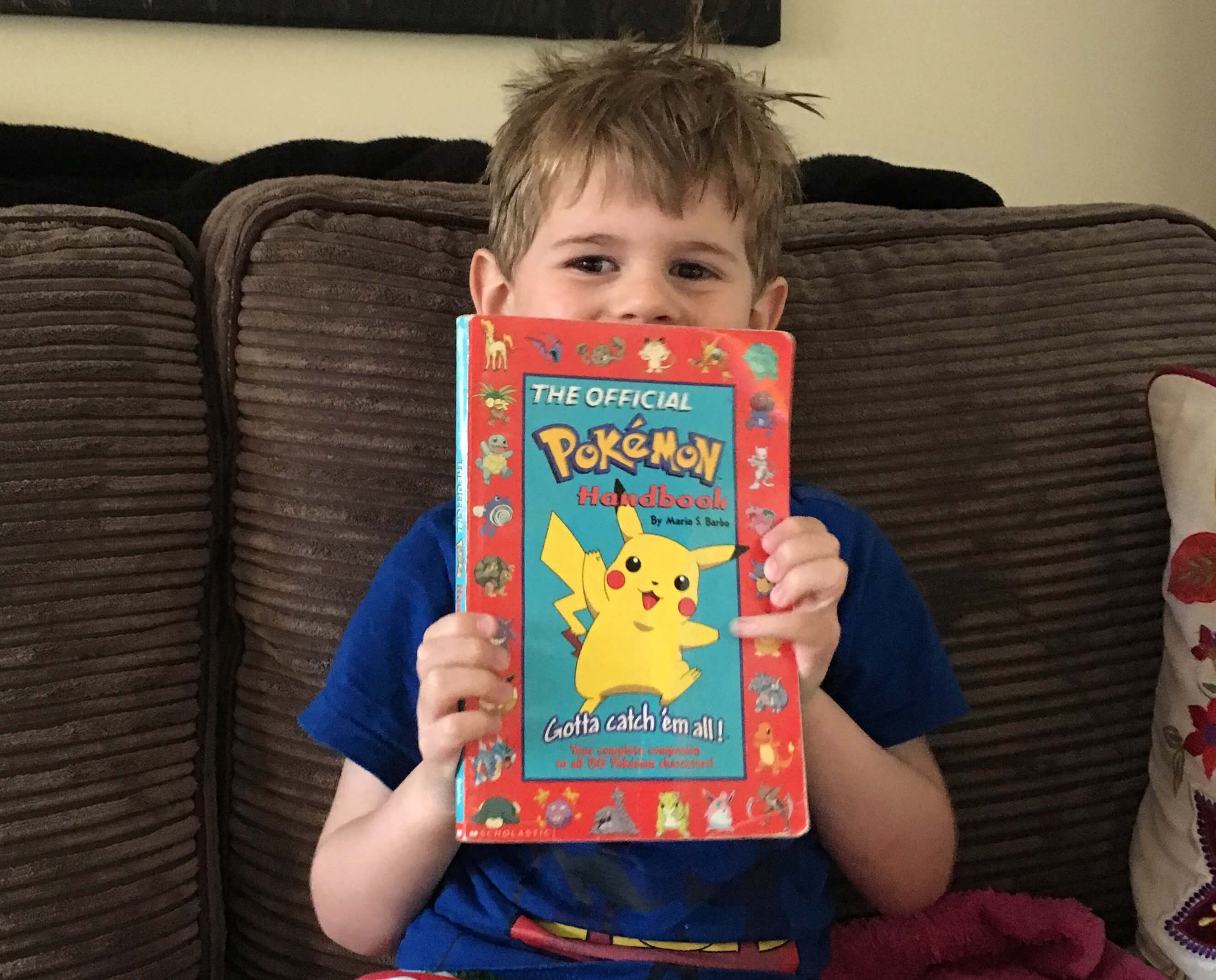 Ethan with my old Pokémon book